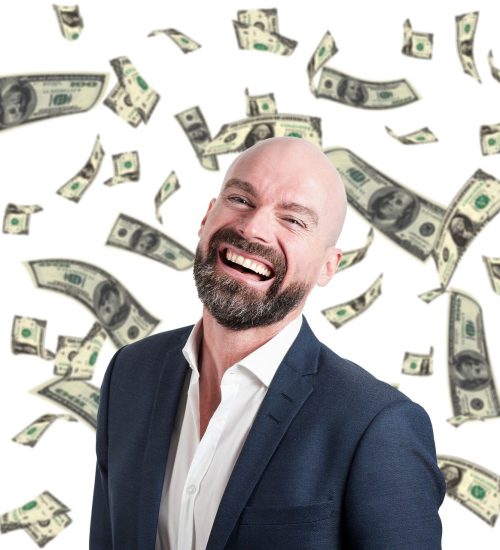 Picture of man under falling money.